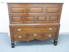 A GEORGE III OAK MULE CHEST, well coloured peg-joined construction with lidded top over a seven
