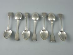 A SET OF SEVEN FIDDLE PATTERNED SILVER DESSERT SPOONS with crested handles, 8.2 troy ozs, Exeter