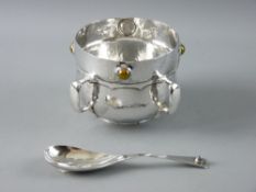 A LIBERTY & CO CYMRIC SILVER FOUR HANDLED BOWL having an inset circular agate between each of the