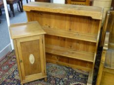 AN ANTIQUE STRIPPED PINE PLATE RACK with shaped sides and a bedside pot cupboard, 98 x 95 cms the
