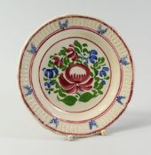 A SWANSEA POTTERY CHILD'S PLATE, Baker, Bevans & Irwin period, the border with continuous moulded