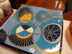 A large pottery abstract decorated square plaque