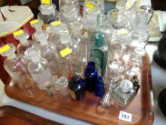 A quantity of pharmaceutical bottles including three with labels