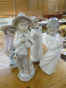 Four various Nao porcelain figures
