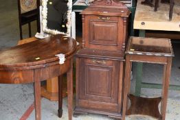 A vintage wooden pedonium with metal handles and upper shelf together with a half-moon antique table