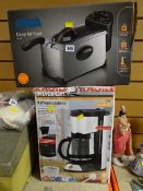 A boxed deep fat fryer and a boxed Silvercrest coffee machine