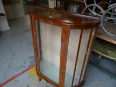 A polished glazed single door china cabinet