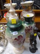 A trio of antique milk glass vases and a metallic sculpture of a colliery worker
