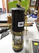 An antique colliery lamp with label for Bedlinog, 1920s and labelled no.18