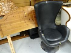 A retro-style swivel armchair on a chrome circular base together with a pine double headboard