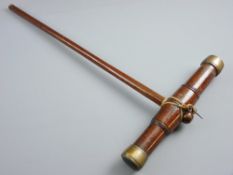 A SHIPWRIGHT'S CAULKING MALLET with brass mounts, 70 cms long