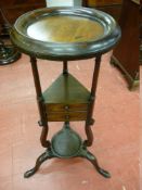 A GEORGIAN MAHOGANY NIGHT STAND with circular top and base tray, shaped central twin drawers on