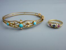 AN EIGHTEEN CARAT GOLD DRESS RING set with red, white and blue stones, 2.6 grms gross, size 'R'