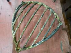AN ANTIQUE CAST CORNER MOUNT HAY FEEDER, 83 cms high, 80 cms wide (one upright to edge absent)