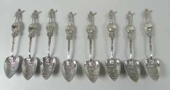A SET OF EIGHT STERLING SILVER 'COLOMBUS' SPOONS with heart shaped bowls, and the handle featuring