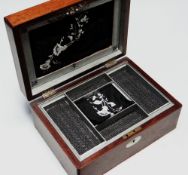 AN EARLY VICTORIAN ROSEWOOD SEWING BOX of plain form with fitted interior and two mother-of-pearl