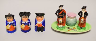 A NOVELTY CARLTONWARE SCOTTISH HIGHLANDER CRUET comprising figural salt and pepperette with