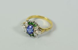 AN 18CT YELLOW GOLD DIAMOND, TANZANITE & SAVORITE RING, 4.7gms