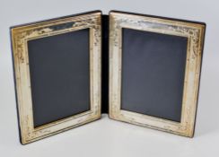 AN ELIZABETH II FOLDING SILVER PORTRAIT FRAME with raised decoration (rubbed) hallmarks for