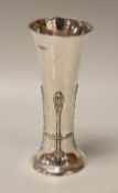 A SILVER TRUMPET VASE having a spreading foot and with raised decoration, London 1904, 8.2ozs