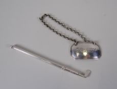 A NOVELTY GOLF CLUB COCKTAIL SWIZZLE with retractable stirrers and a silver BRANDY label bottle-