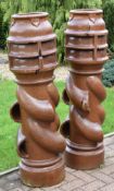 A PAIR OF 'SPIRALVENT' TERRACOTTA CHIMNEY POTS, reg 273442, height 121cms