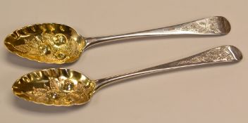 A PAIR OF GEORGE IV SILVER BERRY SPOONS the gilded bowls with raised berry and leaf decoration and