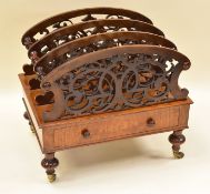 A MAHOGANY CANTERBURY composed of base with single drawer and four scrolled and fretted dividers