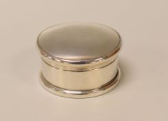 A SILVER PILL BOX of plain circular form, London 1919, 0.9ozs