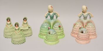THREE CARLTONWARE CRINOLINE DRESS FIGURAL CRUETS comprising a matching pair in differing glazes