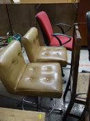 A pair of 1970s buttoned leather effect and chrome revolving bar stools together with two office