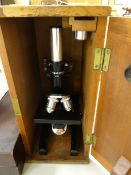 A Phillip Harris laboratory microscope and an older microscope box