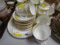 A quantity of Staffordshire yellow floral tea ware