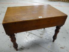 An antique mahogany wash basin