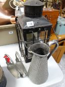 A vintage lantern, a pair of stirrups and a metal jug etc