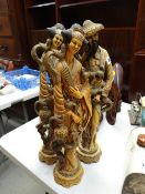 Three Oriental-type resin figures