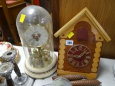 A cuckoo-type clock and a dome clock