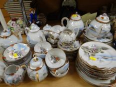 An extensive set of Oriental eggshell cabinet tea ware