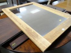 A modern pine framed mirror