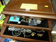 A table top coin chest and contents of coinage, jewellery etc
