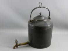A CAST IRON WATER KETTLE with swing handle, knopped lid and long brass tap, 33 cms high