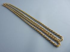A NINE CARAT GOLD MUFF CHAIN, 28 grms