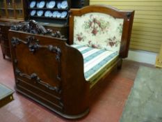 A VICTORIAN MAHOGANY BED, the rear headboard with arched top and side moulding, the head section