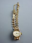 A LADY'S AVIA NINE CARAT GOLD CIRCULAR DIAL WRISTWATCH with dart effect link bracelet, 12.6 grms