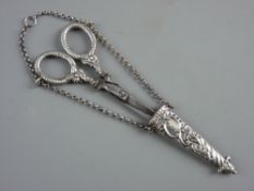 A PAIR OF VICTORIAN CHATELAINE SCISSORS in hanging case by George Unite, steel bladed, the handles