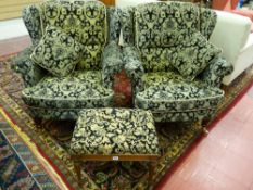 A PAIR OF REPRODUCTION WINGBACK ARMCHAIRS in the Victorian style in a black and light gold