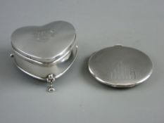 A HEART SHAPED TRINKET BOX and an Art Deco compact, the lidded box standing on three hoof feet,
