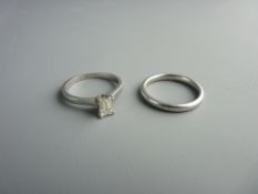 A PLATINUM & BAGUETTE CUT SOLITAIRE ENGAGEMENT RING & WEDDING BAND SET, 8.2 grms gross, size M