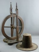 A WELSH WIDE BRIMMED STEEPLE HAT in distressed condition and an early hardwood Welsh spinning