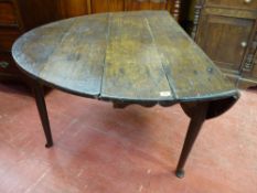 AN ANTIQUE OAK DROP LEAF PAD FOOT DINING TABLE, 72 cms high, 124 cms long, 48.5 cms wide (closed)